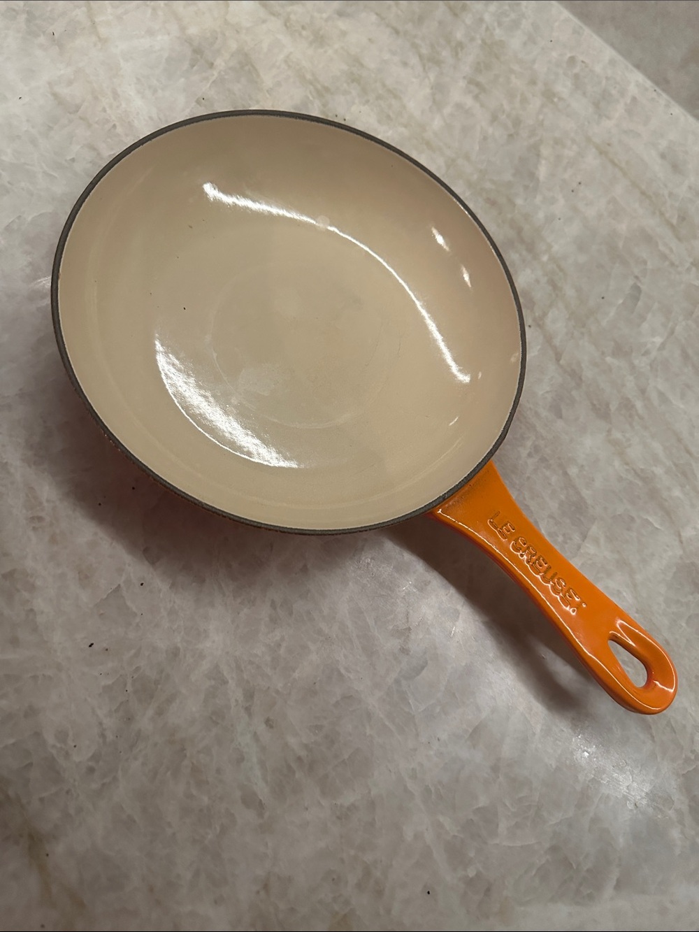 LE creuset orange cast iron pan